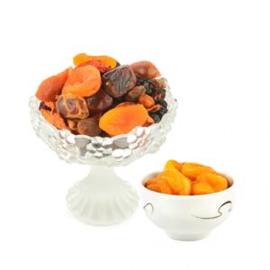 Assorted Dried Fruits and Dates in Elegant Glass and Ceramic Bowls